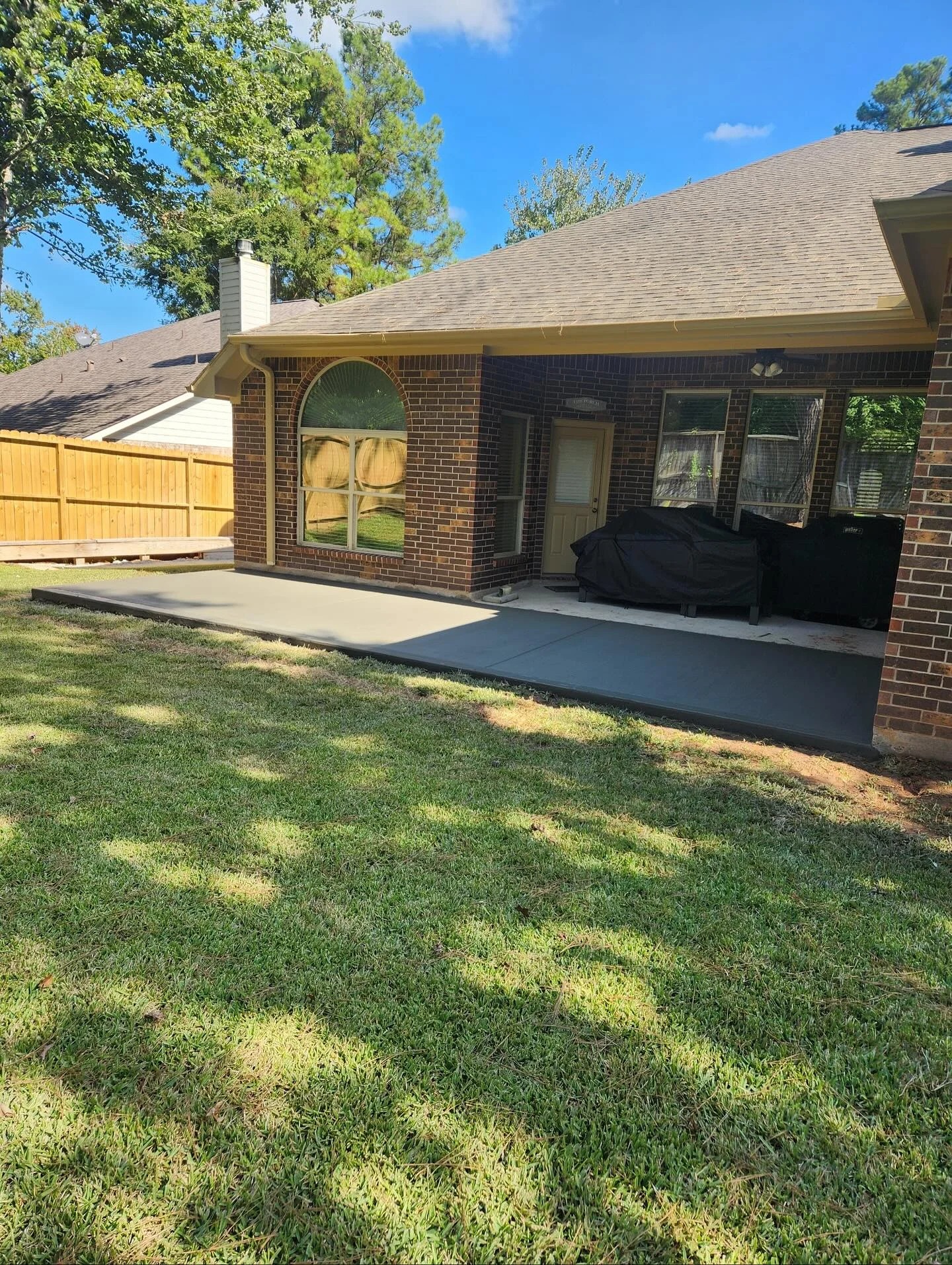stamped overlay on existing patio with wood plank pattern, Conroe, Texas